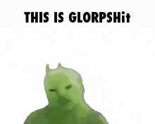 a green cat is laying on its back with the words `` this is glorpshit '' written on it .