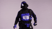 a man is wearing a blue and black ultra shirt