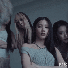 a group of women standing next to each other with the letters ms on the bottom left