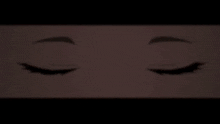 a silhouette of a devil 's face is displayed on a screen