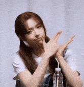 a girl with a bottle of water and the name oldman sunny on the bottom right