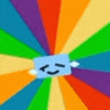 a rainbow colored background with a smiling face in the middle .