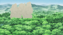 a large rock in the middle of a forest