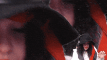 a close up of a woman wearing a hat and headphones with the word shagiia on the bottom