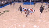 a basketball game is being played on a court with a logo for oklahoma city on it