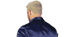 a man with a beard wearing a blue jacket