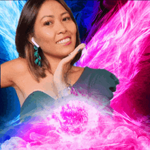 a woman wearing ear buds stands in front of a purple and blue background