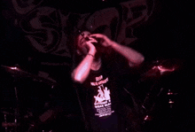 a man wearing a black shirt that says stop drug abuse on it