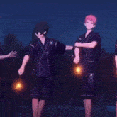a group of anime characters are standing next to each other on a stage holding fireworks .