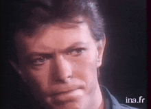 a close up of a man 's face with the website ina.fr visible in the corner