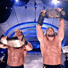 Chris Jericho Chris Benoit GIF - Chris Jericho Chris Benoit Wwe Tag Team Champions GIFs
