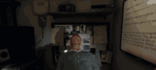 a man is standing in front of a sign that says ' capture a ghost ' on it