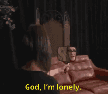 a woman is looking at herself in a mirror and says " god i 'm lonely "