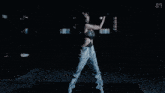 a woman wearing gloves and a crop top with the letter s on the bottom right