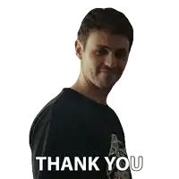 a man wearing a black shirt with the words thank you on it