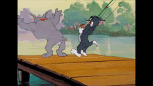 a cartoon of tom and jerry dancing on a pier