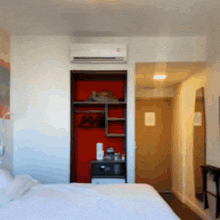 a bedroom with a bed and a closet with a sign that says no smoking