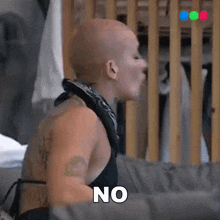 a woman with a bandana around her neck is saying no .