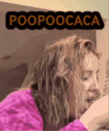 a woman in a pink sweater is looking down with the words poopoocaca above her