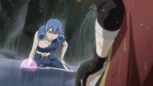 a girl with blue hair is standing in a body of water