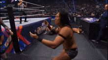 a man in a wrestling ring with the word aew on the bottom right