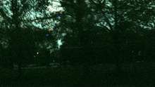 a man sitting in a car looking out the window with a sign that says taxi
