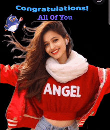 a woman wearing a red angel sweater with a penguin in the background