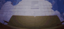 a cartoon drawing of a building with a blue sky behind it