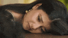 a man with a bandage on his forehead is laying on a bed .