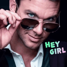 a man wearing sunglasses says " hey girl " on the bottom