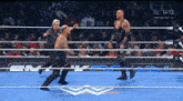 two wrestlers in a wrestling ring with the usa logo on the bottom right