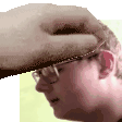 a close up of a man wearing glasses and a hat with a hand on his head .