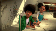 a boy in a green jacket is playing a video game