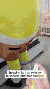 a person spraying fart spray in a spongebob suit