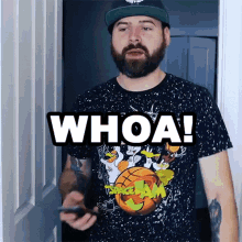a man with a beard wearing a space jam t-shirt