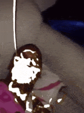 a drawing of a person laying on a couch with a pink and white blanket