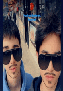 two men wearing sunglasses are standing next to each other in front of a store