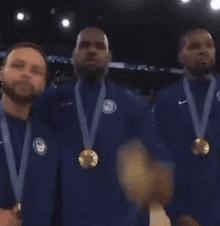 a group of men wearing medals are shaking hands on a court .