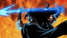 a man in a black cape is holding a large blue sword in front of a fire background .
