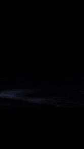 a close up of a glowing object with a black background