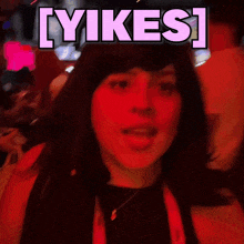 a woman in a dark room with the words lyikes written above her