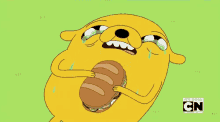 jake the dog adventure time crying eating sandwich lying down