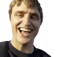 a close up of a man 's face with his mouth open and his teeth showing