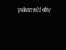 a picture of a city with the words " yukamaki city " on the bottom