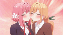 a girl with pink hair is kissing another girl