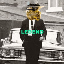 a man in a suit and tie is standing in front of a car with the word legend written on it