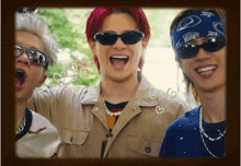 a group of young men wearing sunglasses and bandanas