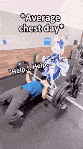 a man is lifting weights in a gym with a picture of a girl on the wall behind him