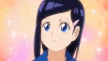 a girl with long black hair is smiling and wearing a sailor suit .
