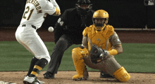 a baseball player with the number 21 on his jersey swings at a ball